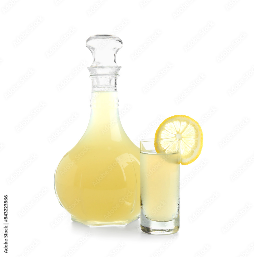 Shot and bottle of tasty Limoncello on white background Shot and bottle of tasty Limoncello on white background