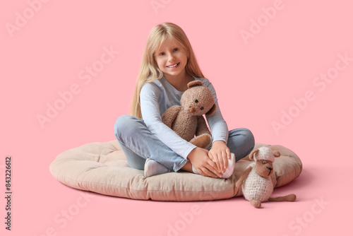 Cute little girl with plush...