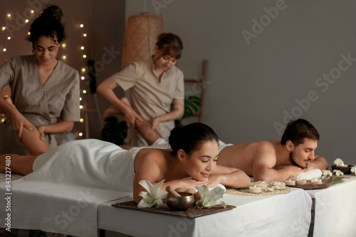 Young couple getting massag...