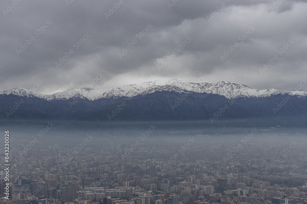 Skyline of Santiago de Chile with modern office buildings, with Cordilheiras mountains at the background.