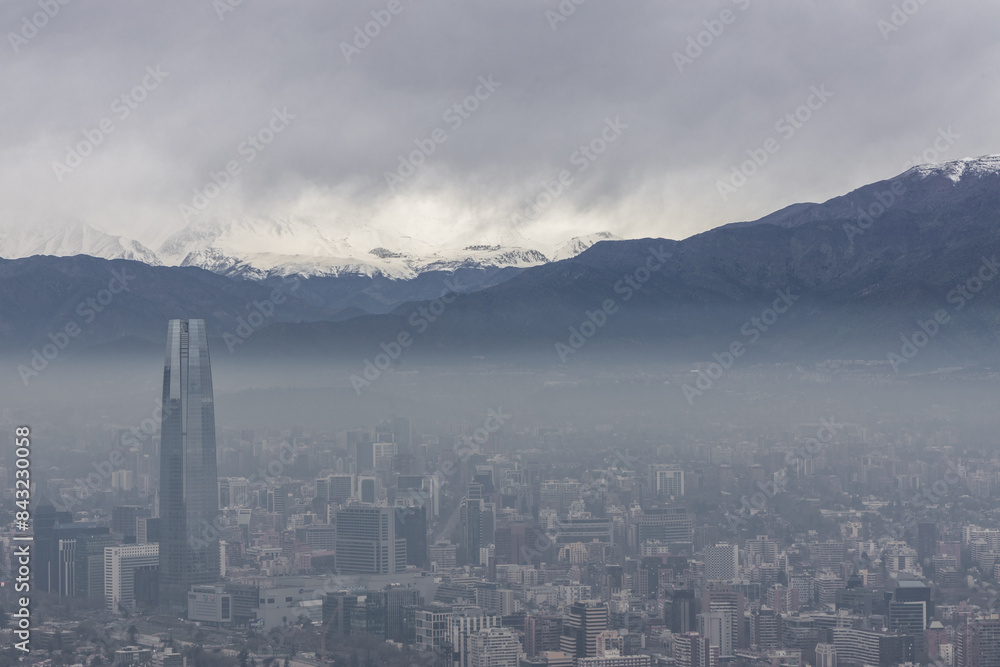 Skyline of Santiago de Chile with modern office buildings, with Cordilheiras mountains at the background.