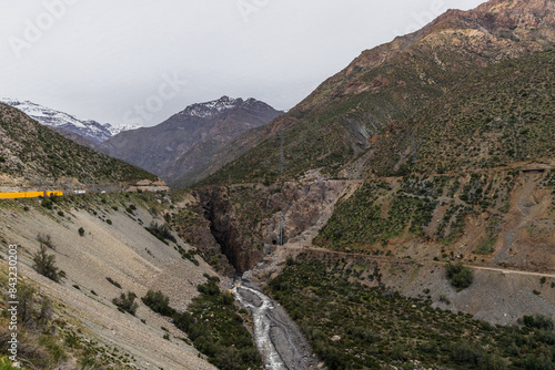 Obraz na płótnie A freezing day high in the Andes Mountains in Chile, with mountains covered in snow. w salonie