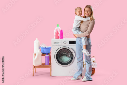 Happy mother holding her li...