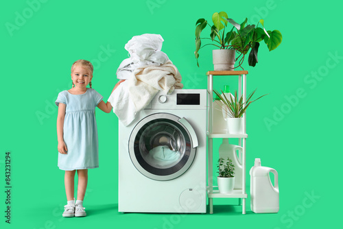 Little girl with heap of di...