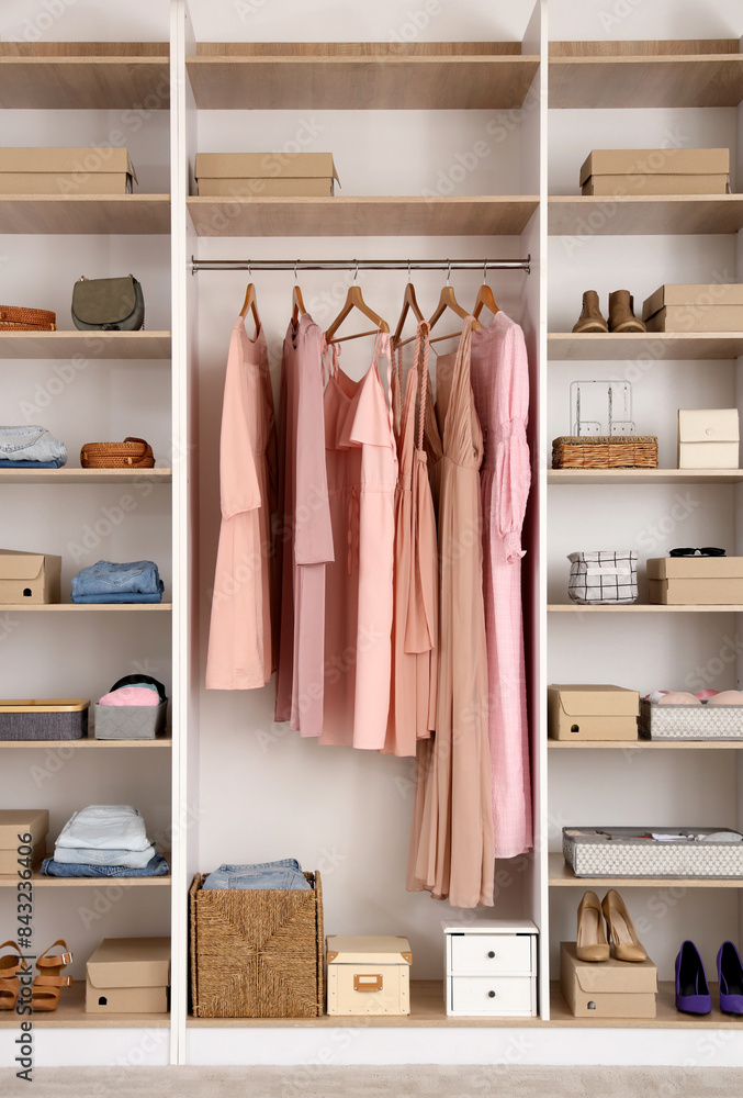 Big wardrobe with different stylish clothes and accessories in dressing room Big wardrobe with different stylish clothes and accessories in dressing room