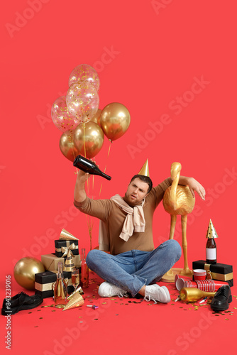 Young man with hangover and...