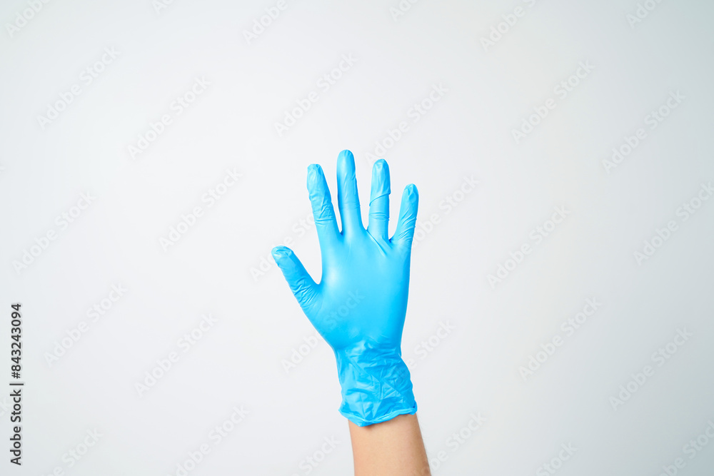 hand gestures or signs in blue disposable latex surgical gloves isolated hand gestures or signs in blue disposable latex surgical gloves isolated