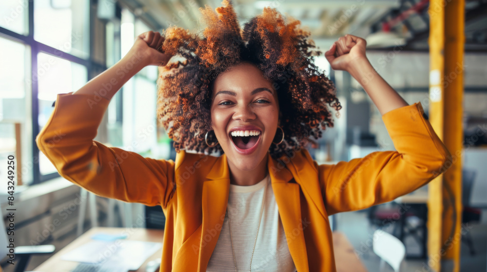 A woman with curly hair is smiling and raising her hands in the air A woman with curly hair is smiling and raising her hands in the air