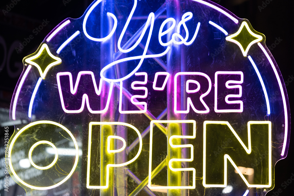 Fototapeta premium Neon light Yes we're open sign night festival pink yellow