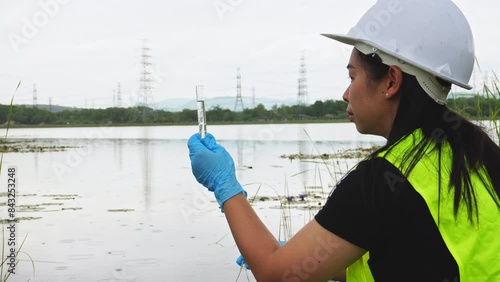 Environmental engineers analyze water quality and creature from natural source. Biologists taking samples of water and algae samples. Ecology field research.
