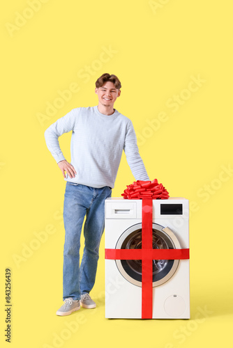 Young man with gift washing...