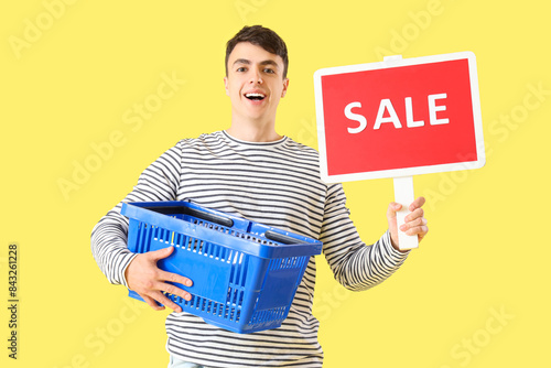 Young man with shopping bas...