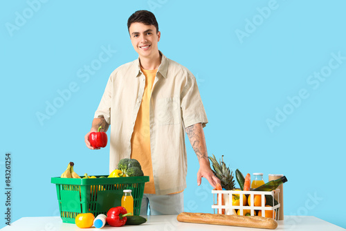 Young man with full shoppin...