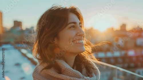 Photo of a Smiling Woman Looking Out Across Her New Ro photo