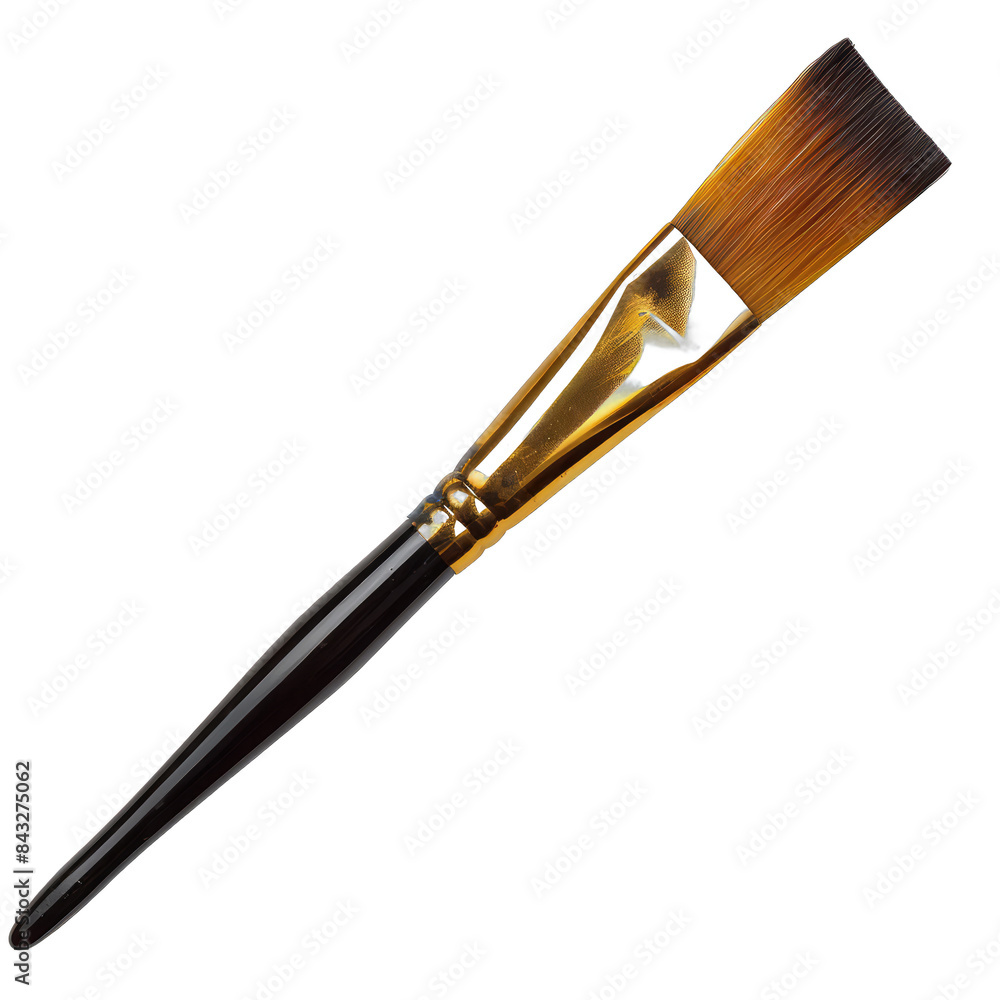 A brush with a gold handle and a black tip A brush with a gold handle and a black tip