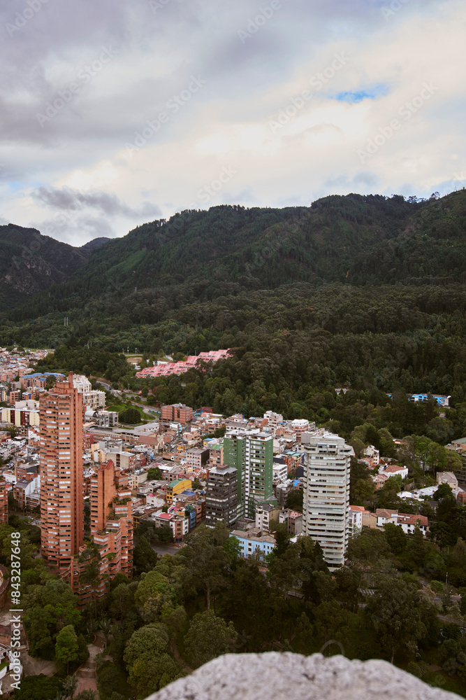 Obraz premium Urban Panorama: An aerial view of Bogotá from the Torre Colpatria reveals the sprawling cityscape. The Plaza Cultural La Santamaría stands out among iconic buildings
