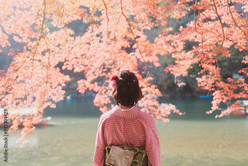 Woman in Kimono in Arashiyama in Autumn in Kyoto, Japan