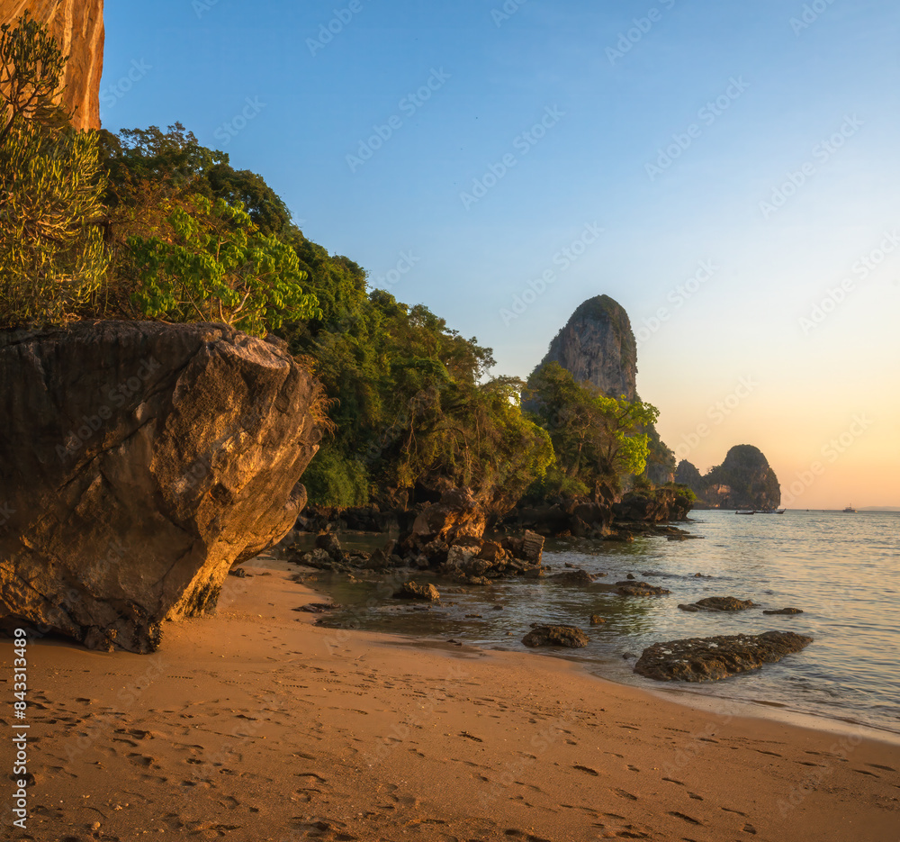 sunset at tonsai beach in railay in krabi in thailand