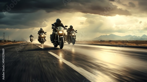 A group of motorcyclists riding on a highway, captured in motion with a dramatic sky overhead photo