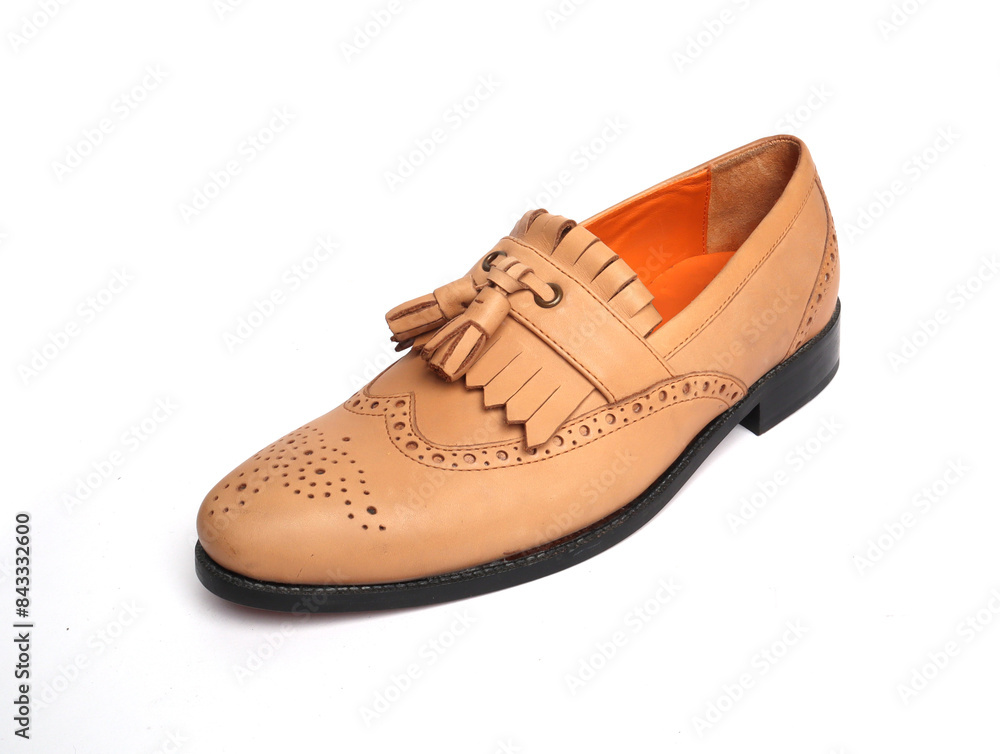 tan tassel and fringes formal shoes on white background tan tassel and fringes formal shoes on white background