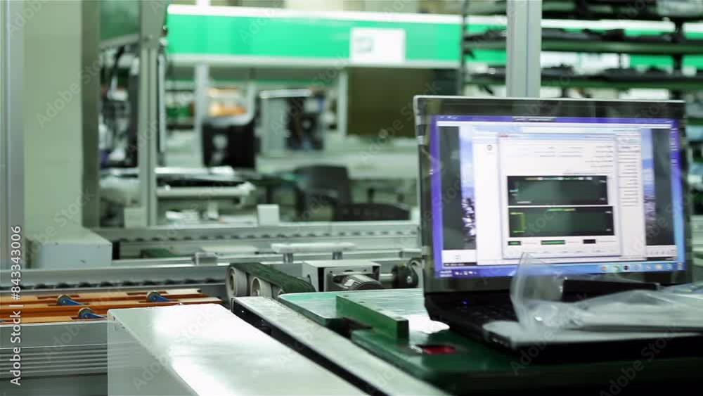 Laptops Moving along a Conveyor Belt in the Laptop Factory. 4K Resolution. Laptops Moving along a Conveyor Belt in the Laptop Factory. 4K Resolution.