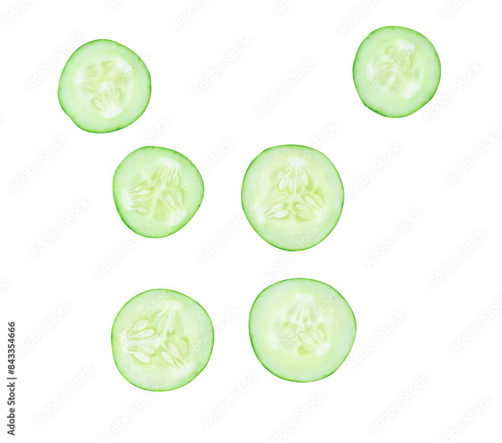 Top view set of green cucumber slices or pieces in circle shape scattering isolated on white background with clipping path Top view set of green cucumber slices or pieces in circle shape scattering isolated on white background with clipping path