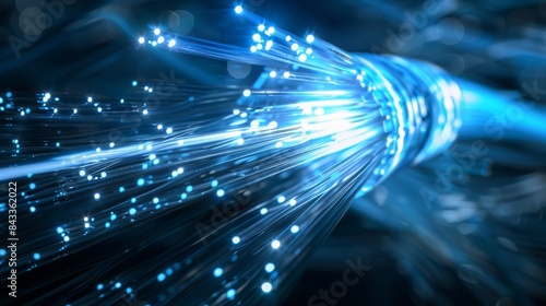 Blue fiber optic cable transmitting data at high speed photo