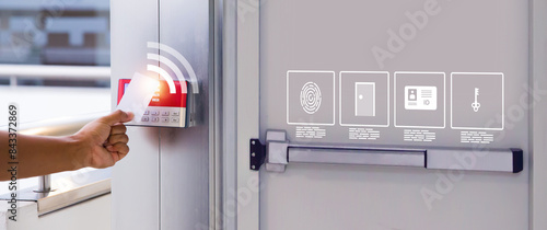 Hand scanning proximity ID card on reader access control system for door unlock with security icons for identity or verification identify for safety detect fingerprint scan or check attendance.