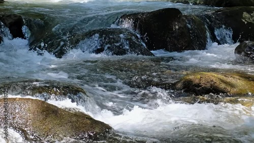 Video of the Altai mountain river Verkhniy Kulash, the right tributary of the Chulyshman.  Zoom effect. photo