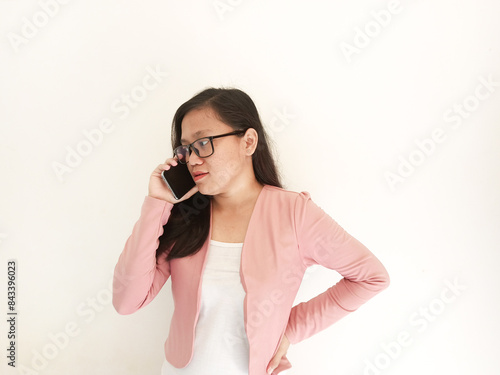 A career woman appears to be smiling at the beginning before her expression changes when she looks at the work report in her office