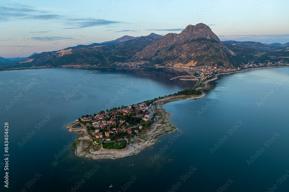 Fototapeta premium Aerial view of Egirdir town in Turkey. A small turkish town in the middle of the giant lake under the mountains.