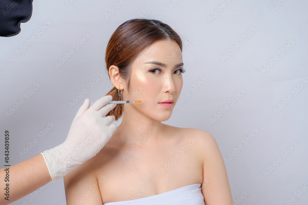 Botox Beauty Asian Woman's Quest for Youthfulness Isolated White Background. Ideal for Skincare Ads, Beauty Clinics, Spa and Salon Botox Beauty Asian Woman's Quest for Youthfulness Isolated White Background. Ideal for Skincare Ads, Beauty Clinics, Spa and Salon