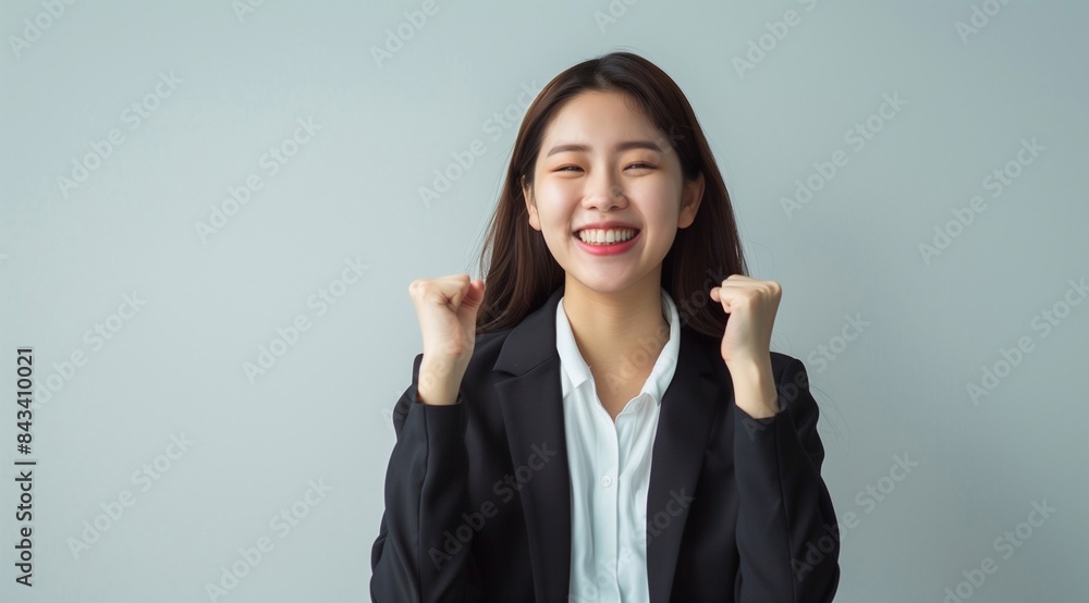 korean smart happy entrepreneur business woman smile in casual suit gesture aised hands celebrating success and looking at camera on isolated grey background. generative AI korean smart happy entrepreneur business woman smile in casual suit gesture aised hands celebrating success and looking at camera on isolated grey background. generative AI
