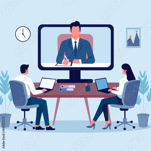 Employees in a corporate office attending a meeting through online video conference