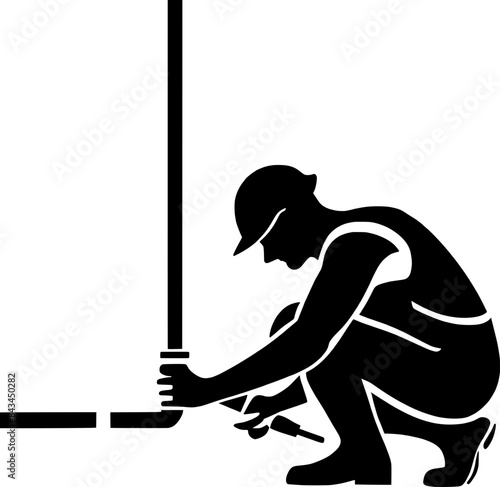 Plumber repairing a pipe