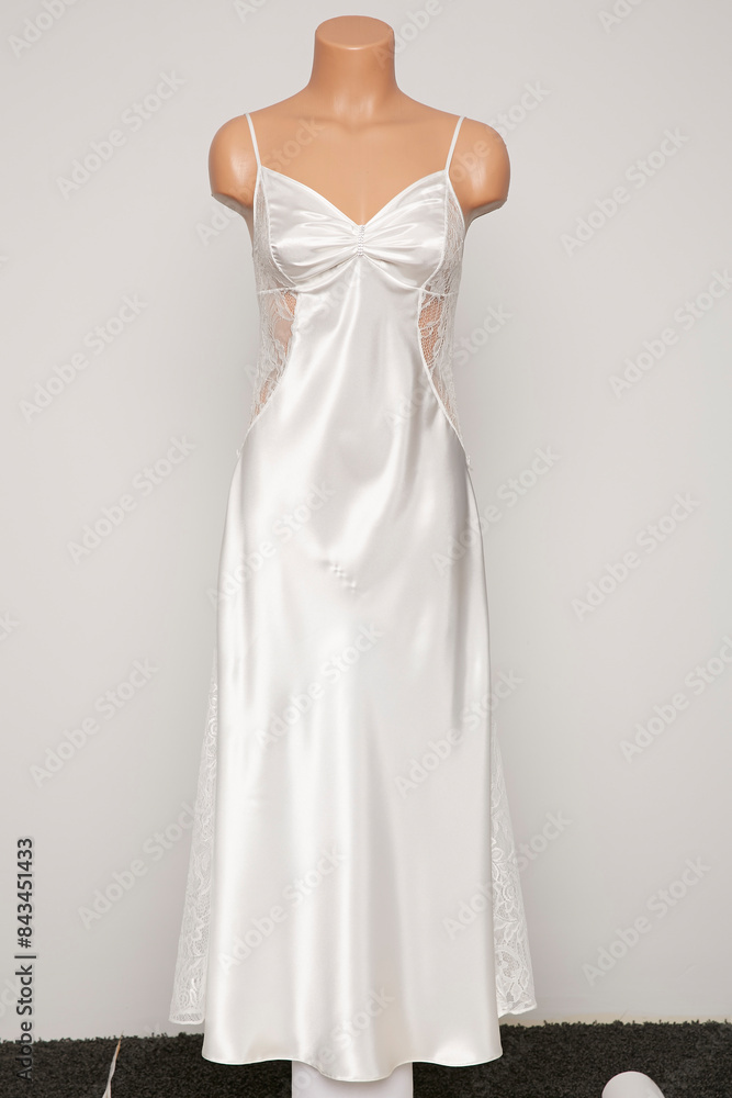 Fototapeta premium Satin female nighty on a white background.