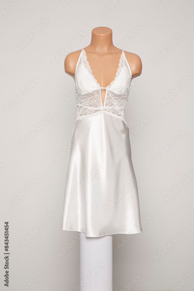 Fototapeta premium Satin female nighty on a white background.