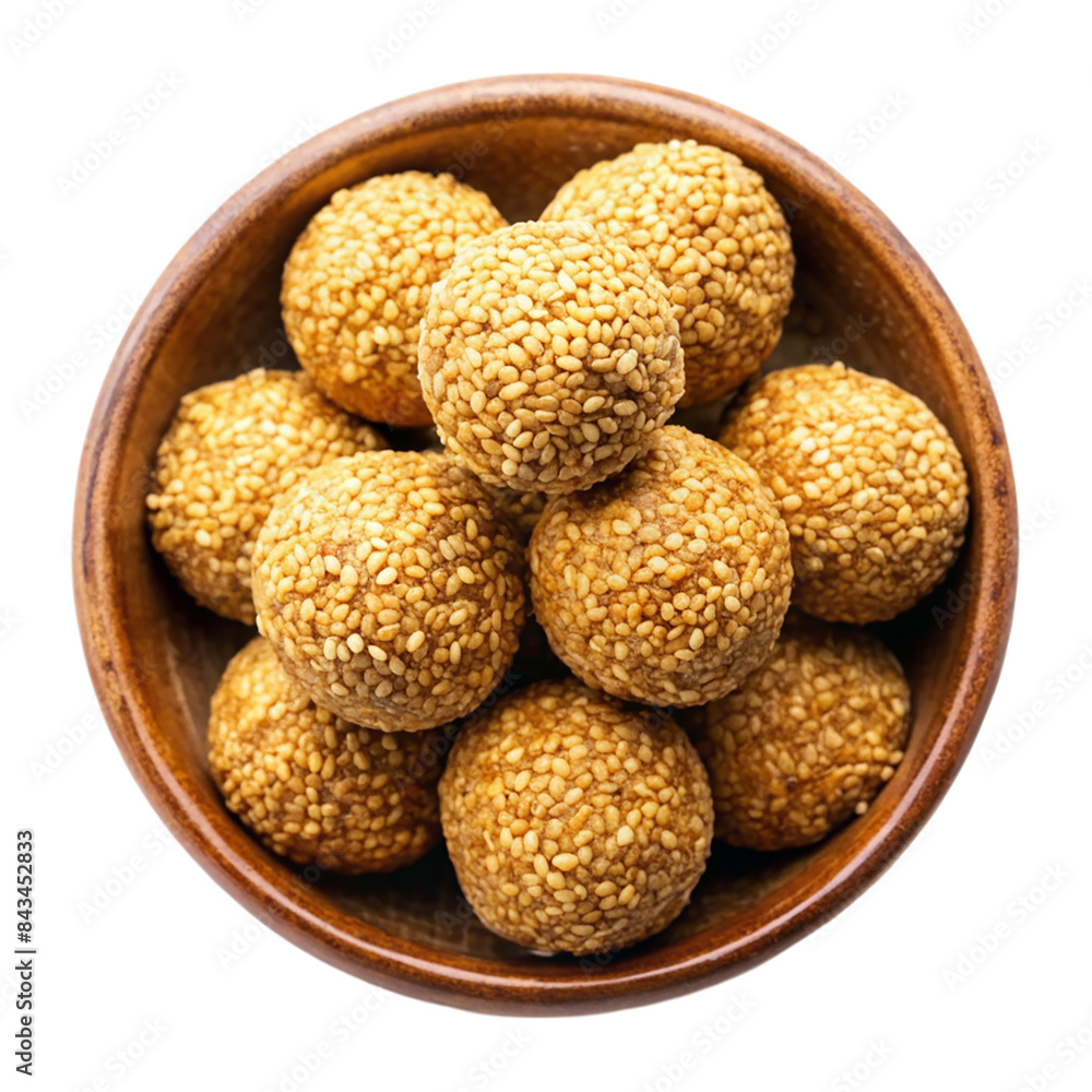 Indian sweet sesame laddu or til laddu in a bowl Isolated on transparent background Indian sweet sesame laddu or til laddu in a bowl Isolated on transparent background