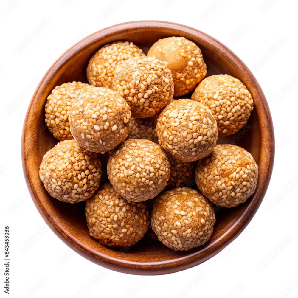 Indian sweet sesame laddu or til laddu in a bowl Isolated on transparent background Indian sweet sesame laddu or til laddu in a bowl Isolated on transparent background
