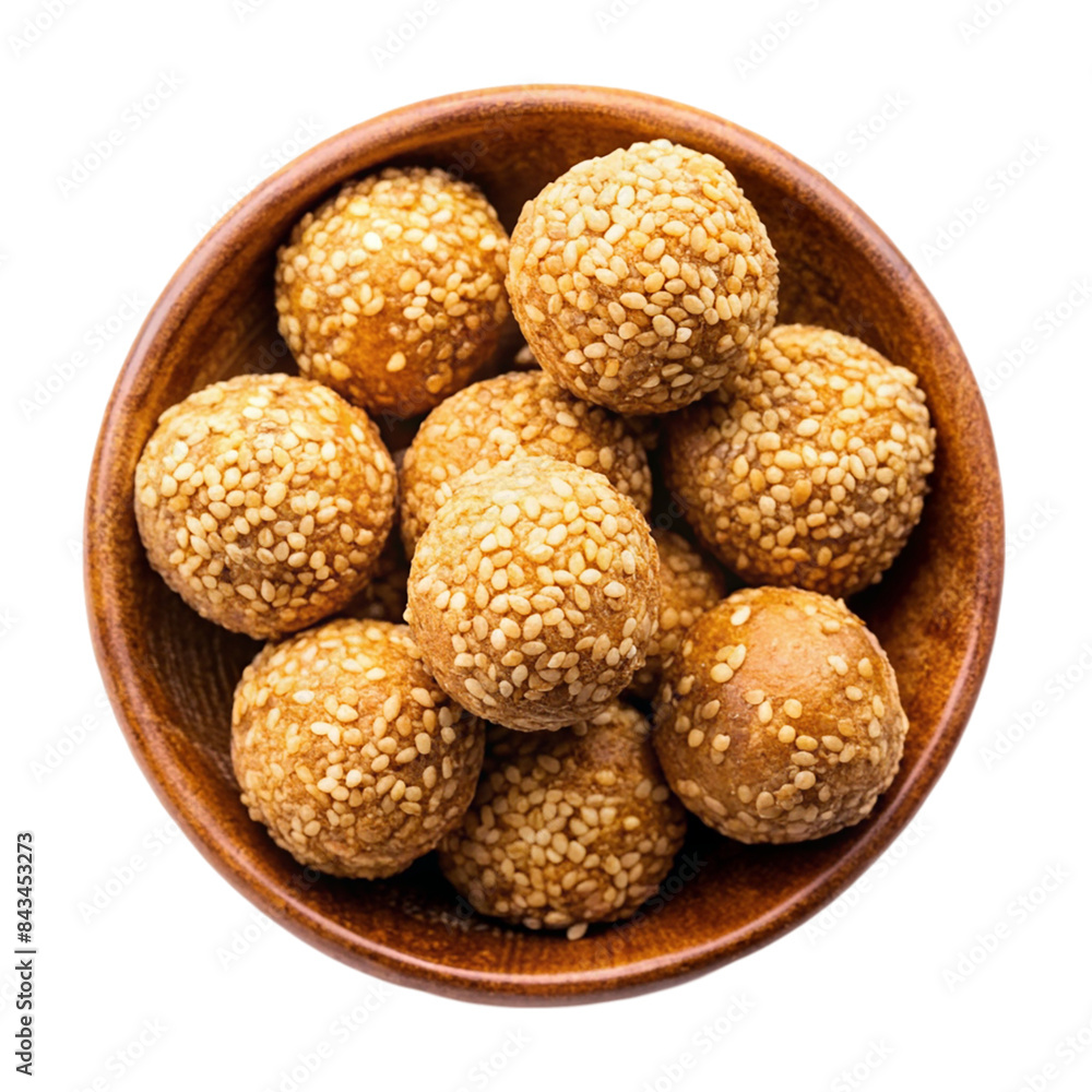 Indian sweet sesame laddu or til laddu in a bowl Isolated on transparent background Indian sweet sesame laddu or til laddu in a bowl Isolated on transparent background