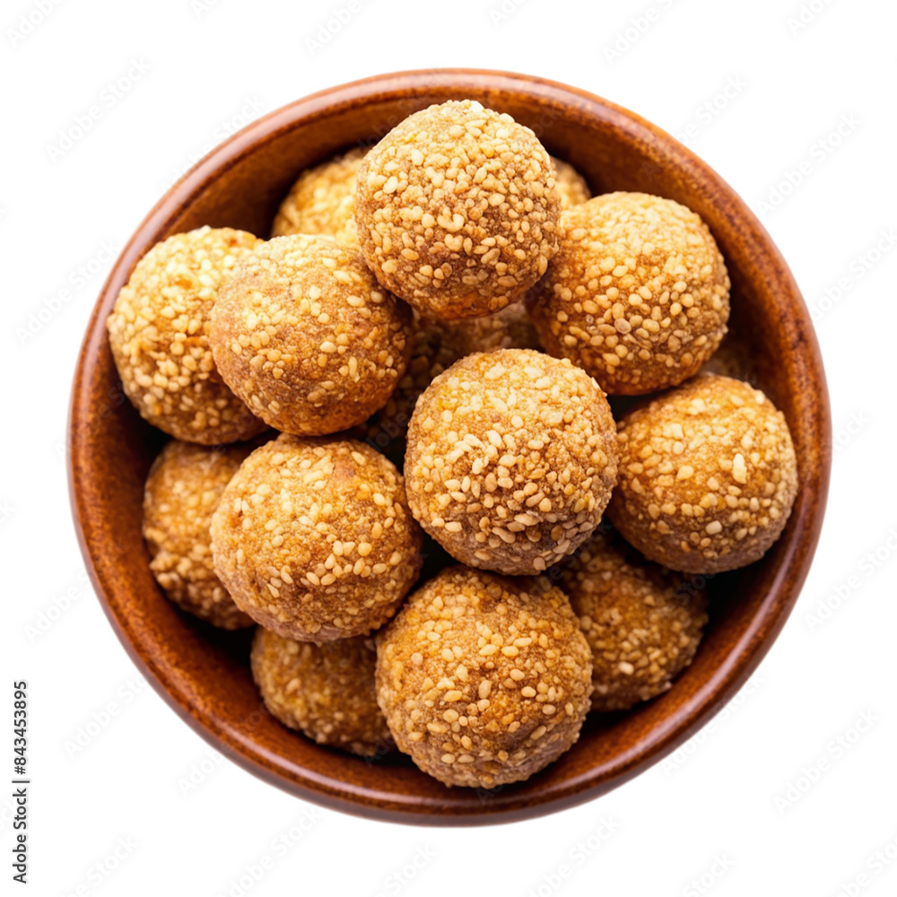 Indian sweet sesame laddu or til laddu in a bowl Isolated on transparent background Indian sweet sesame laddu or til laddu in a bowl Isolated on transparent background