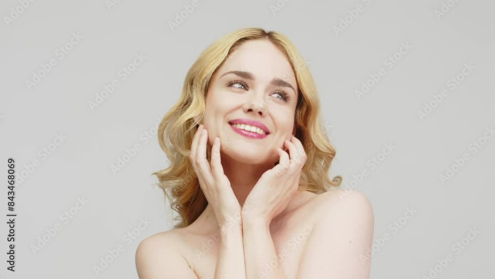 Portrait of a beautiful young blonde woman with perfect facial skin on a white background. The concept of advertising healthy skin, beauty and cosmetology. Portrait of a beautiful young blonde woman with perfect facial skin on a white background. The concept of advertising healthy skin, beauty and cosmetology.