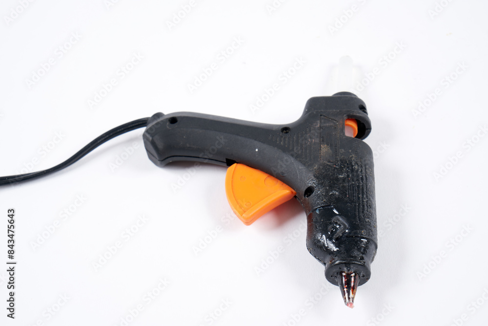 hot glue gun on a white surface hot glue gun on a white surface