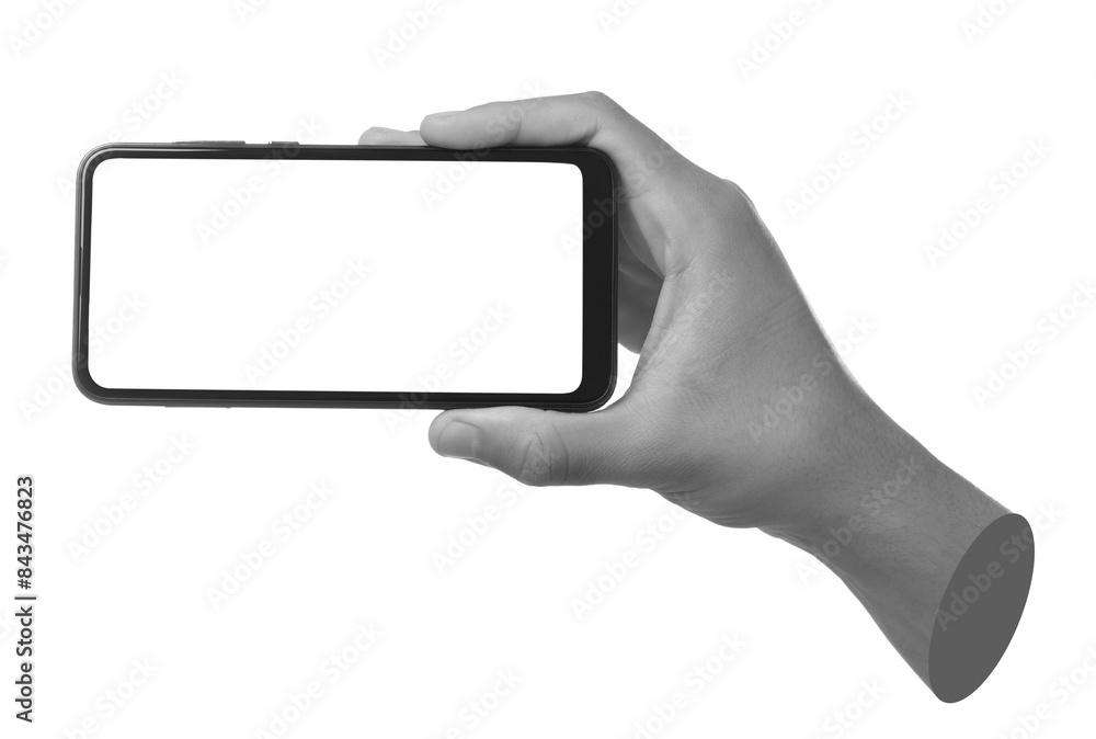 Man's hand holding mobile phone with empty screen isolated on white. Black and white effect Man's hand holding mobile phone with empty screen isolated on white. Black and white effect