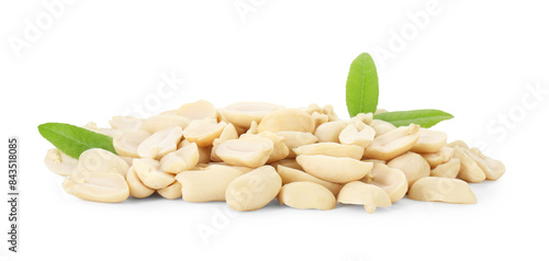 Fresh peeled peanuts and green leaves isolated on white
