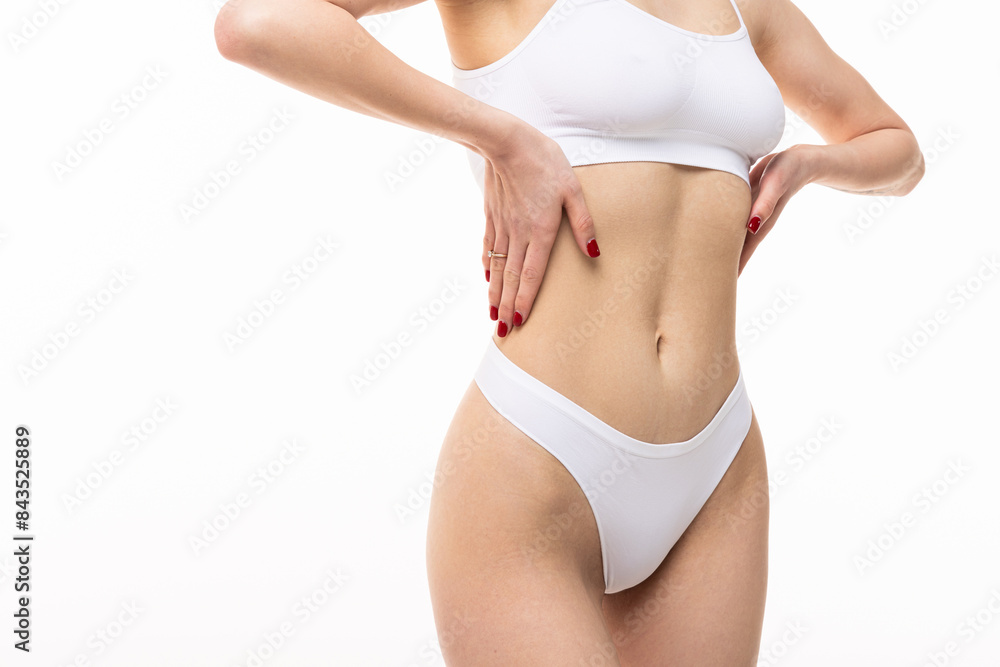 Sexy belly over white background. Close up. Sexy belly over white background. Close up.