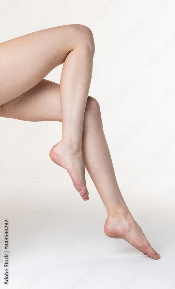 Closeup of a sexy female legs on white background Closeup of a sexy female legs on white background