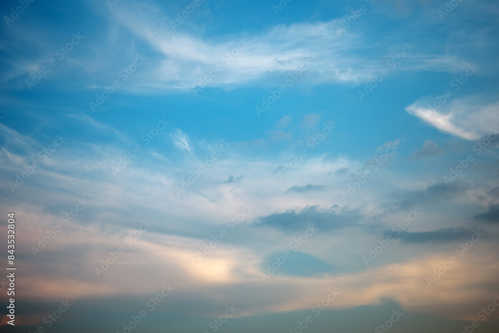 Majestic dusk. Beautiful bright blue sky with golden and grey clouds. Soft cloud in twilight. Calm cloudy sky on evening time. Abstract nature background. Fresh air, weather and freedom concept Majestic dusk. Beautiful bright blue sky with golden and grey clouds. Soft cloud in twilight. Calm cloudy sky on evening time. Abstract nature background. Fresh air, weather and freedom concept
