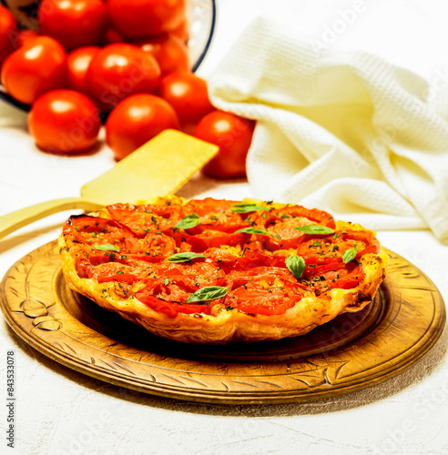 tarta tatin de tomates confitados y bacalao  photo