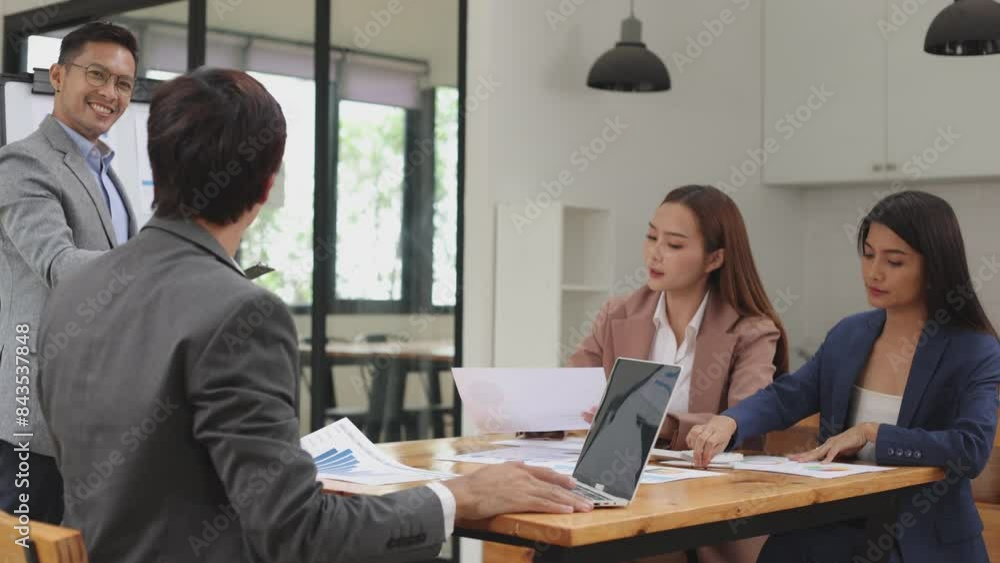 Team of Asian business people and working together in office, Startup projects and business presentation. Team of Asian business people and working together in office, Startup projects and business presentation.